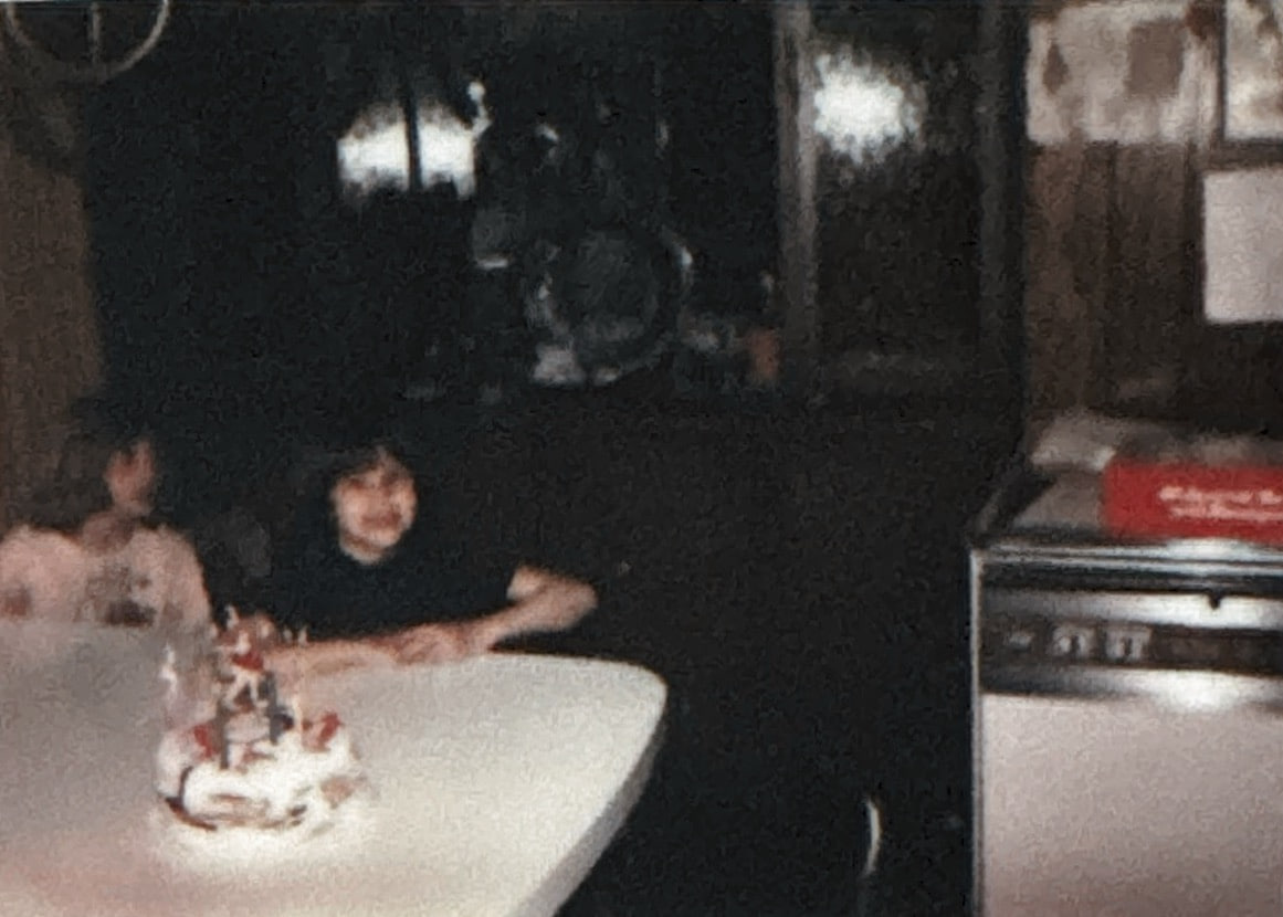 Damaged 1970s family photo before restoration